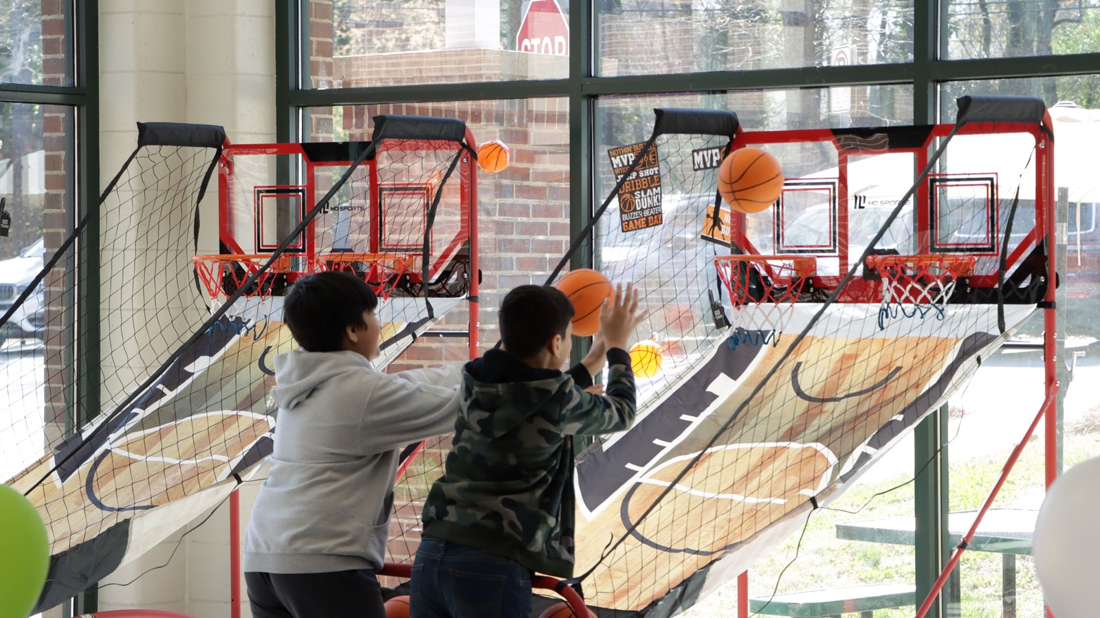 Pine Mountain Middle School students play basketball inside the school's game center.